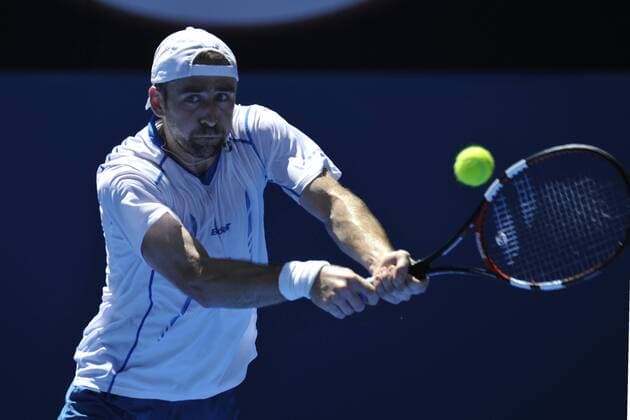 24.01.2015 Australian Open Tennis from Melbourne Park. Benjamin Becker of Germany returns a shot in his match against Milos Raonic of Canada on day six of the 2015 Australian Open at Melbourne Park, Melbourne, Australia. xEssixLimx  ActionPlus11591818