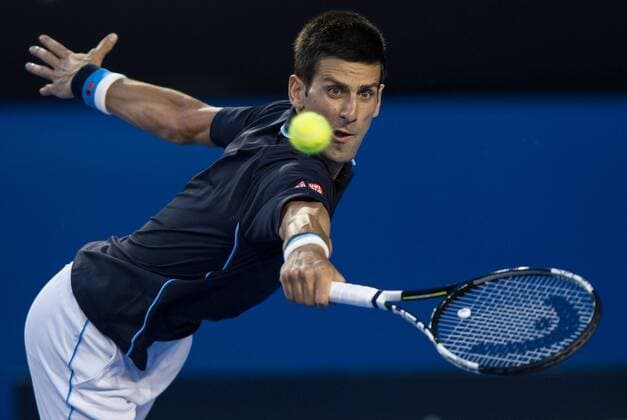 (150124) -- MELBOURNE, Jan. 24, 2015 -- Novak Djokovic of Serbia returns the ball during the men s singles third round match at the 2015 Australian Open tennis tournament at Melbourne Park in Melbourne, Australia, Jan. 24, 2015. (SP)AUSTRALIA-MELBOURNE-TENNIS-DJOKOVIC BaixXue 
