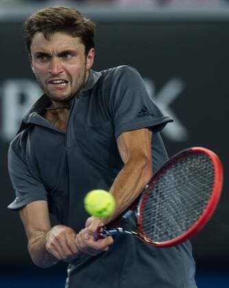 (150124) -- MELBOURNE, Jan. 24, 2015 -- Gilles Simon of France returns the ball during the men s singles third round match at the 2015 Australian Open tennis tournament at Melbourne Park in Melbourne, Australia, Jan. 24, 2015. (SP)AUSTRALIA-MELBOURNE-TENNIS-GILLES SIMON BaixXue 