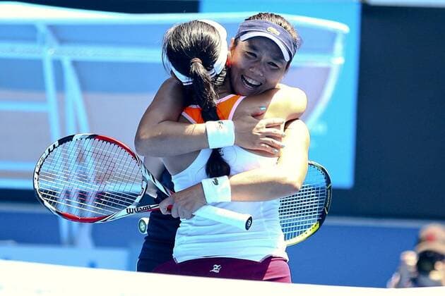Yung-Jan Chan of Chinese Taipei and Jie Zheng of China in action in their semifinal doubles match during day 10 of the 2015 Australian Open at Melbourne Park on January 28, 2015 in Melbourne, Australia.  CFP462411207 