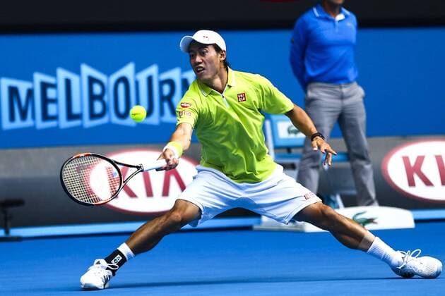Kei Nishikori of Japan plays a backhand in his quarterfinal match during day 10 of the 2015 Australian Open at Melbourne Park on January 28, 2015 in Melbourne, Australia.  CFP462412838 