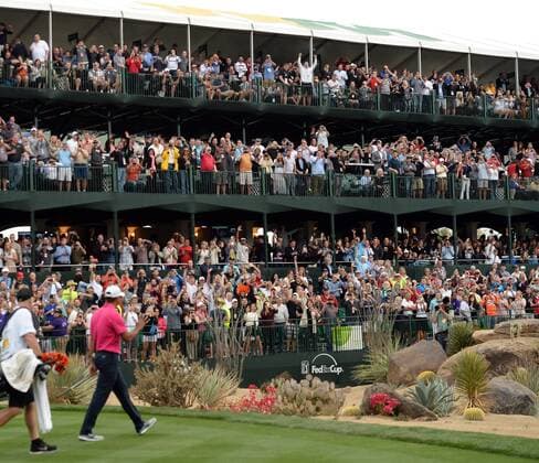 Tiger Woods waves to the crowd as he walks to the green on the sixteenth hole of the Waste Management Phoenix Open at the Fairmont Scottsdale Princes golf course in Scottsdale, Arizona January 29, 2015.  PXP2015012920 ARTxFOXALL