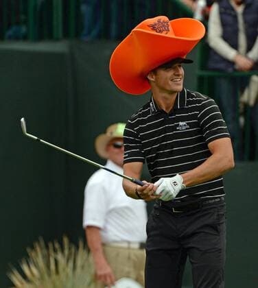 Morgan Hoffmann wears a foam cowboy hat as he gets ready to tee off on the sixteenth hole of the Waste Management Phoenix Open at the Fairmont Scottsdale Princes golf course in Scottsdale, Arizona January 29, 2015.  PXP2015012922 ARTxFOXALL
