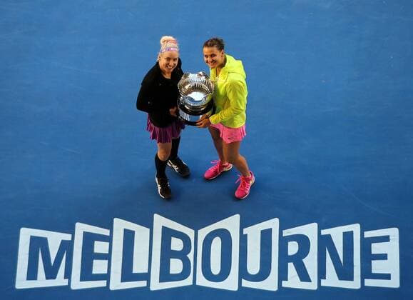 (150130) -- MELBOURNE, Jan. 30, 2015 -- Bethanie Mattek-Sands (L) of the U.S.and Lucie Safarova of the Czech Republic celebrate after winning their women s doubles final at the 2015 Australian Open tennis tournament at Melbourne Park in Melbourne, Australia, Jan. 30, 2015. WOMEN S DOUBLES FINAL XuxYanyan 