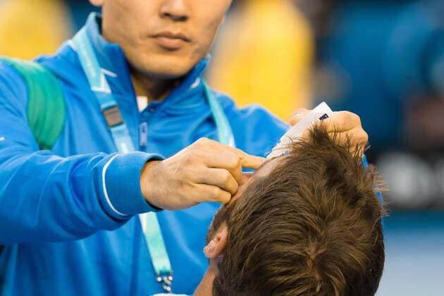 January 30, 2015: 4th seed Stan Wawrinka (SUI) receives medical attention in a Semifinals match on day twelve of the 2015 Australian Open grand slam tennis tournament at Melbourne Park in Melbourne, Australia. Sydney Low Cal Media. Tennis 2015: Australian Open JAN 30 - ZUMAc04_