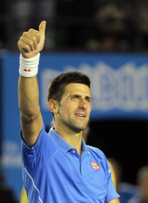 Serbia s Novak Djokovic celebrates his victory in the men s singles semifinal match at the Australian Open tennis championship in Melbourne, Australia, Jan. 30, 2015. (SP)AUSTRALIA-MELBOURNE-TENNIS-AUSTRALIAN OPEN JinxLinpeng 