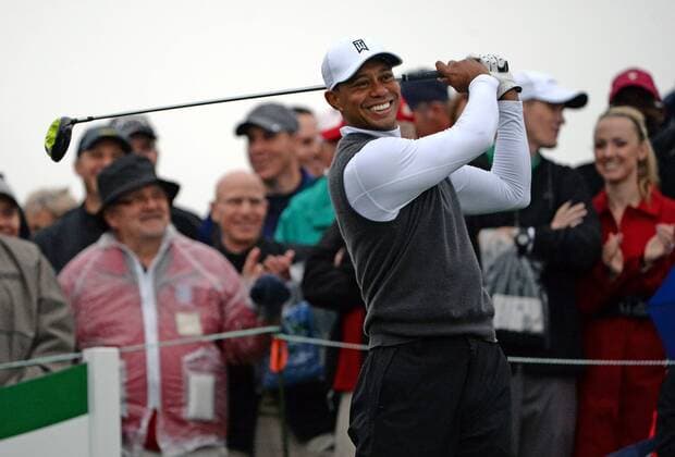 Tiger Woods smiles as he takes a practice swing before taking his tee shot on the tenth hole of the second round of the Waste Management Phoenix Open at the Fairmont Scottsdale Princes golf course in Scottsdale, Arizona January 30, 2015.  PXP2015013001 ARTxFOXALL