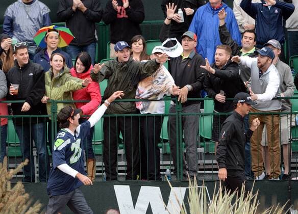 Bubba Watson throws a visor into the crowd as he walks from tee to green on the sixteenth hole of the second round of the Waste Management Phoenix Open at the Fairmont Scottsdale Princes golf course in Scottsdale, Arizona January 30, 2015.  PXP2015013011 ARTxFOXALL