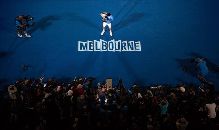 (150201) -- MELBOURNE, Feb. 1, 2015 -- Novak Djokovic (C) of Serbia poses with the trophy after winning his men s singles final match at 2015 Australian Open tennis tournament at Melbourne Park in Melbourne, Australia on Feb. 1, 2015. BaixXue 