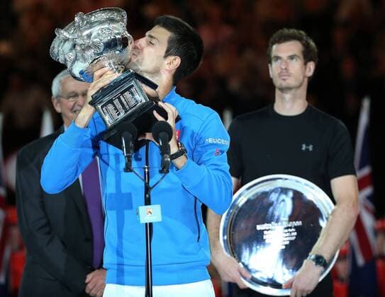 (150201) -- MELBOURNE, Feb. 1, 2015 -- Novak Djokovic of Serbia kisses the trophy after winning his men s singles final match at 2015 Australian Open tennis tournament at Melbourne Park in Melbourne, Australia on Feb. 1, 2015. XuxYanyan 