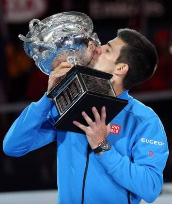 (150201) -- MELBOURNE, Feb. 1, 2015 -- Novak Djokovic of Serbia kisses the trophy after winning his men s singles final match at 2015 Australian Open tennis tournament at Melbourne Park in Melbourne, Australia on Feb. 1, 2015. XuxYanyan 