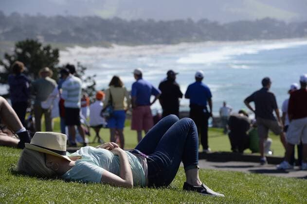 Feb. 15, 2015 - Pebble Beach, CA, USA - A spectator takes a nap near the eighth tee box during the final round of the AT&T Pebble Beach National Pro-Am at Pebble Beach Golf Links in Pebble Beach, Calif., on Sunday, Feb. 15, 2015. Pebble Beach National Pro-Am - ZUMAm67_