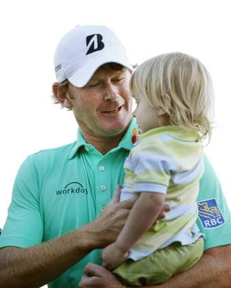 Feb. 15, 2015 - Pebble Beach, CA, USA - Brandt Snedecker holds his son, Austin, 2-1 2, on the 18th green after winning the ATandT Pebble Beach National Pro-Am at Pebble Beach Golf Links in Pebble Beach, Calif., on Sunday, Feb. 15, 2015. Snedecker shot 22 under par for the tournament. Pebble Beach National Pro-Am - ZUMAm67_