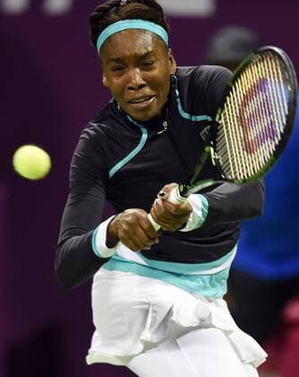 (150224) -- DOHA, Feb. 23, 2015 -- Venus Williams of the United States returns the ball during the first round match against CaseyDellacqua of Australia in the WTA Tennis Damen Qatar Open tennis tournament in Doha, Qatar, Feb. 23, 2015. Venus Williams won 2-1. ) (SP)QATAR-DOHA-TENNIS-WTA ChenxShaojin 