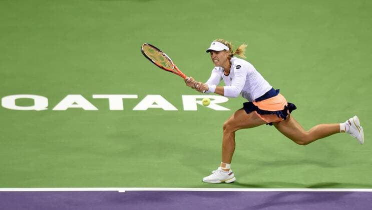 (150224) -- DOHA, Feb. 23, 2015 -- Angelique Kerber of Germany returns the ball during the first round match against VictoriaAzarenka of Belarus in the WTA Tennis Damen Qatar Open tennis tournament in Doha, Qatar, Feb. 23, 2015. Angelique Kerber lost 0-2. ) (SP)QATAR-DOHA-TENNIS-WTA ChenxShaojin 