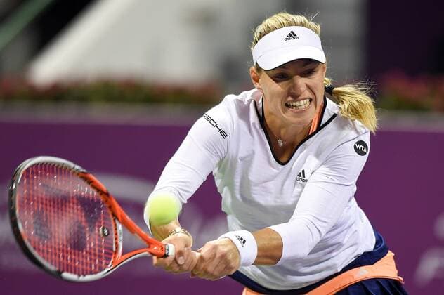 (150224) -- DOHA, Feb. 23, 2015 -- Angelique Kerber of Germany returns the ball during the first round match against VictoriaAzarenka of Belarus in the WTA Tennis Damen Qatar Open tennis tournament in Doha, Qatar, Feb. 23, 2015. Angelique Kerber lost 0-2. ) (SP)QATAR-DOHA-TENNIS-WTA ChenxShaojin 