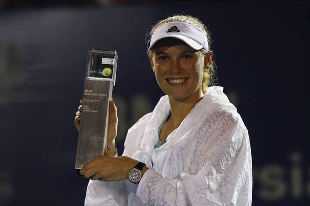 March 8, 2015 - Kuala Lumpur, Malaysia - Denmark s Caroline Wozniacki poses with a trophy after won the final match of the WTA Tennis Damen Malaysian Open 2015 tennis tournament in Kuala Lumpur, Malaysia, 08 March 2015. WTA Tennis Malaysia  - ZUMAn230