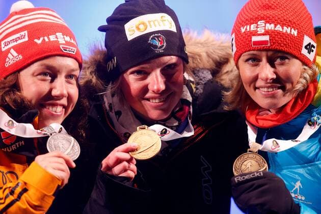 BIATHLON - IBU WC Kontiolahti 2015 KONTIOLAHTI,FINLAND,08.MAR.15 - BIATHLON - IBU World Championships, 10km pursuit, ladies, Medal Plaza, award ceremony. Image shows Laura Dahlmeier (GER), Marie Dorin Habert (FRA) and Weronika Nowakowska-Ziemniak (POL).