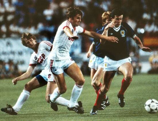 Football - 1982 World Cup Finals - First Round, Group Six: Scotland 2 Soviet Union 2. Scotland s John Robertson and USSR s Oleg Blokhin at the Estadio La Rosaleda, Malaga, Spain. 22 06 1982 