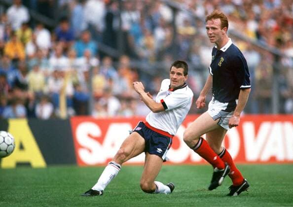 Football - 1989 Rous Cup - Scotland 0 England 2 Steve Bull, making his debut, scores England s second goal as Scotland s Alex McLeish looks on at Hampden Park. 27 05 1989 