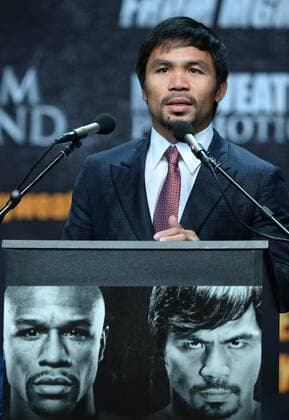 Manny Pacquiao of the Philippines addresses the media promoting his upcoming boxing match with U.S. boxer Floyd Mayweather during a news conference in Los Angeles on March 11, 2015. The fight is set for May 2nd in Las Vegas.  LAP2015031113 JIMxRUYMEN
