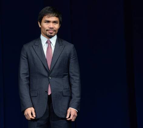 Manny Pacquiao of the Philippines attends a news conference promoting his upcoming boxing match with in Los Angeles on March 11, 2015. The fight is set for May 2nd in Las Vegas.  LAP2015031123 JIMxRUYMEN
