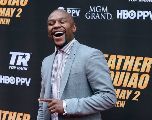 U.S. boxer Floyd Mayweather arrives on the red carpet prior to a news conference promoting his upcoming boxing match in Los Angeles on March 11, 2015. The fight is set for May 2nd in Las Vegas.  LAP2015031132 JIMxRUYMEN