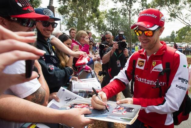 (150312) -- MELBOURNE, March 12, 2015 -- Scuderia Ferrari Formula One driver Sebastian Vettel of Germany signs autographs for his fans ahead of Australian Formula One Grand Prix at Albert Park in Melbourne, Australia, March 12, 2015. ) (SP)AUSTRALIA-MELBOURNE-F1 BaixXue 