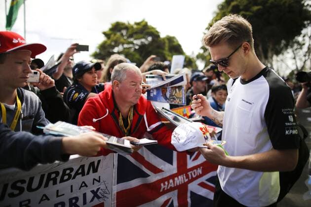March 12, 2015 - Melbourne, Australia - KEVIN MAGNUSSEN of Denmark, reserve driver for McLaren Honda signs autographs for the fans during preparations of the 2015 Australian Grand Prix at Albert Park Circuit in Melbourne, Australia. F1 2015 - Australian Grand Prix - Preparations - ZUMAg147