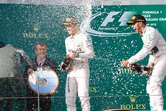 March 15, 2015: Lewis Hamilton (GBR) 44 (1st) and Nico Rosberg (DEU) 6 (2nd) spray champagne at Jackie Stewart on the podium at the 2015 Australian Formula One Grand Prix at Albert Park, Melbourne, Australia. Sydney Low Cal Media Formula One 2015: Australia MAR 15 - ZUMAc04_