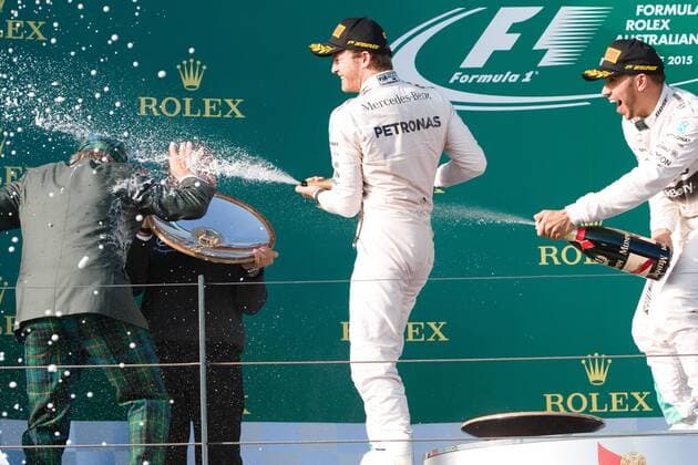March 15, 2015: Lewis Hamilton (GBR) 44 (1st) and Nico Rosberg (DEU) 6 (2nd) spray champagne at Jackie Stewart on the podium at the 2015 Australian Formula One Grand Prix at Albert Park, Melbourne, Australia. Sydney Low Cal Media Formula One 2015: Australia MAR 15 - ZUMAc04_