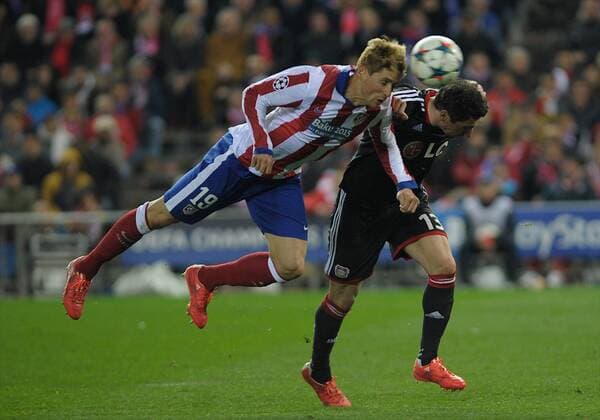 Atletico de Madrid Forward, Fernando Torres, number 19 . Bayer 04 Leverkusen Defender, Roberto Hilbert, number 13. Round 1 8 of the CHAMPIONS league, soccer match between Atletico de Madrid - Bayer 04 Leverkusen at the Vicente Calderon estadium, Madrid - Spain by March 17, 2015. 