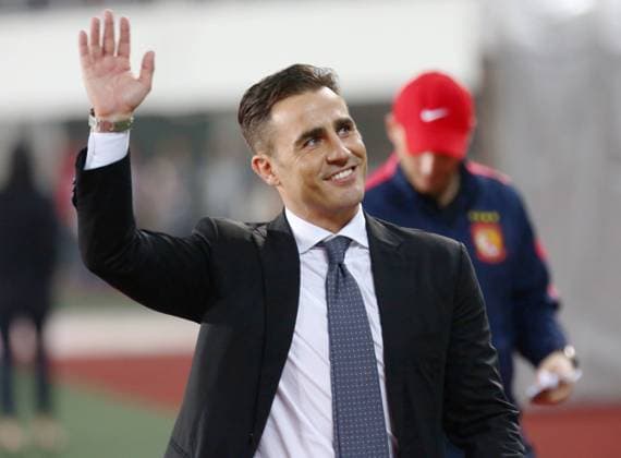 Head coach Fabio Cannavaro of Guangzhou Evergrande waves to spectators after his team scored a goal against Kashima Antlers during their 2015 AFC Champions League Group H third round match in Guangzhou city, south China s Guangdong province, 18 March 2015. the top of Group H in the AFC Champions League.  20150318_13739