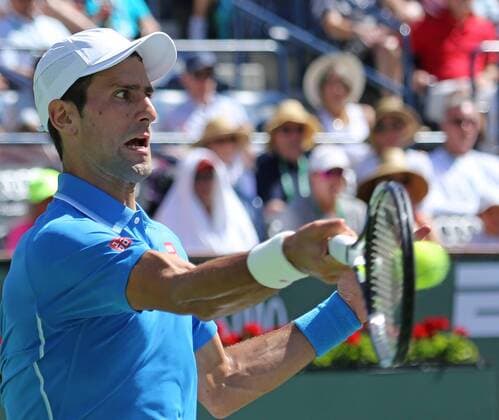 Novak Djokovic of Serbia hits a shot during his men s semifinal match at the BNP Paribas Open in Indian Wells, California on March 21, 2015.  IDW20150321707 DAVIDxSILPA