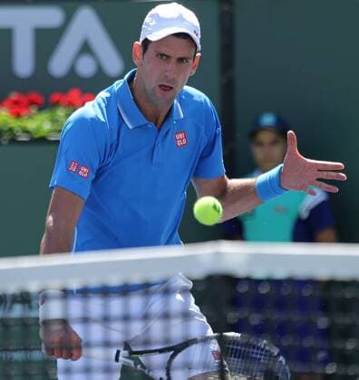 Novak Djokovic of Serbia hits a shot during his men s semifinal match at the BNP Paribas Open in Indian Wells, California on March 21, 2015.  IDW20150321710 DAVIDxSILPA