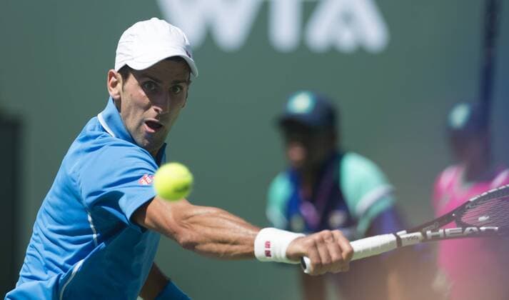 Novak Djokovic of Serbia returns the ball during the men s semifinal match on the BNP Paribas Open tennis at the Indian Wells Tennis Garden in Indian Wells, California, the United States on March 21, 2015. (SP)US-INDIAN WELLS-TENNIS-BNP PARIBAS OPEN-DJOKOVIC YangxLeic 