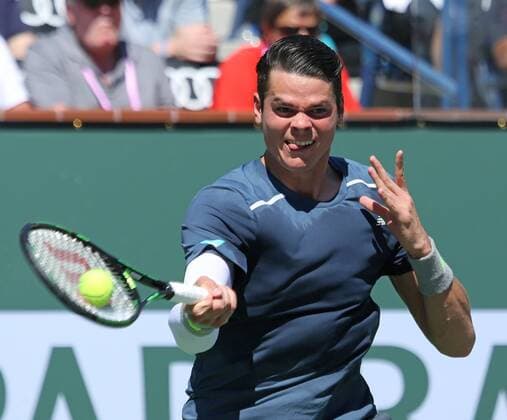 Milos Raonic of Canada hits a shot during his men s semifinal match at the BNP Paribas Open in Indian Wells, California on March 21, 2015.  IDW20150321741 DAVIDxSILPA