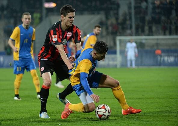 24.03.2015, xjhx, Fussball 1.Bundesliga, Eintracht Frankfurt - Kosovo, v.l. Johannes Flum (Eintracht Frankfurt), Bersar Halimi (Kosovo)