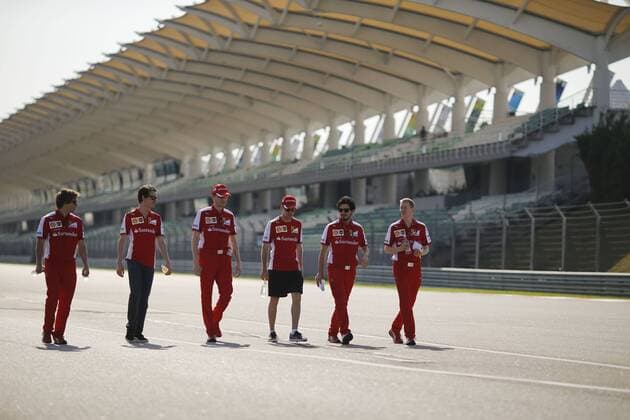 March 26, 2015 - Sepang, Malaysia - SEBASTIAN VETTEL of Germany and Scuderia Ferrari is seen walking the track with Scuderia Ferrari personnel during preparations to the 2015 Formula 1 Malaysia Grand Prix at Sepang International Circuit in Sepang, Malaysia. F1 2015 - Malaysia Grand Prix - Preparations - ZUMAg147