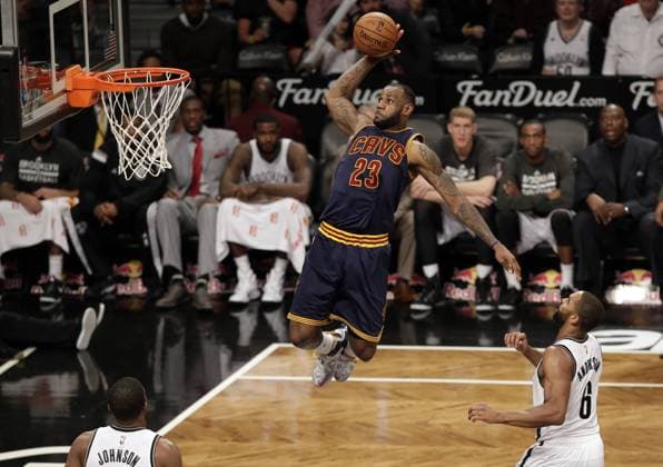 Cleveland Cavaliers LeBron James dunks the basketball in the 4th quarter against the Brooklyn Nets at Barclays Center in New York City on March 27, 2015. The Nets defeated the Cavaliers 106-98. UPI John Angelillo  NYP20150327157 JOHNxANGELILLO