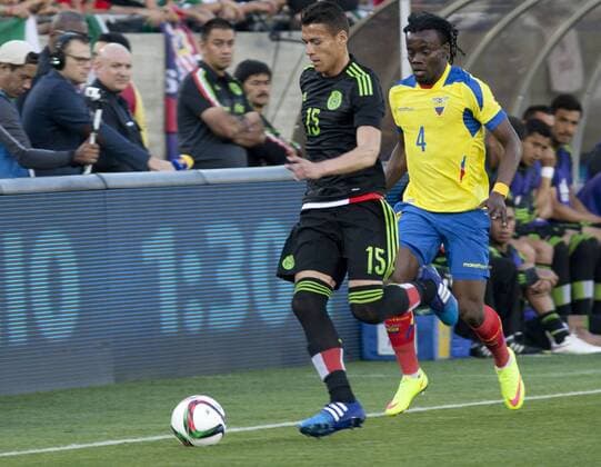 March 28, 2015 - Los Angeles, CALIFORNIA, UNITED STATES OF AMERICA - Mexican player (15) Hector Moreno fights for the ball with Ecuadorian player Miller BolaÃƒÂ±os during thee first half of their game at the Los Angeles Memorial Coliseum for the friendly game today Saturday 28 March 2015.ARMANDO ARORIZO US News - March 28, 2015 - ZUMAa60_
