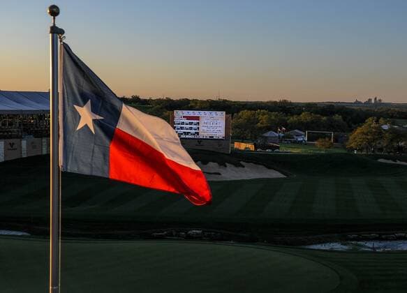 Mar 27, 2015- San Antonio, TX-- A beautiful sunrise lights up the Texas flag prior to the second round play of the Valero Texas Open at the AT&T Oaks Course, TPC San Antonio in San Antonio, Texas. GOLF: MAR 27 PGA Golf Herren - Valero Texas Open - Second Round Icon1503270032015 EDITORIAL USE ONLY