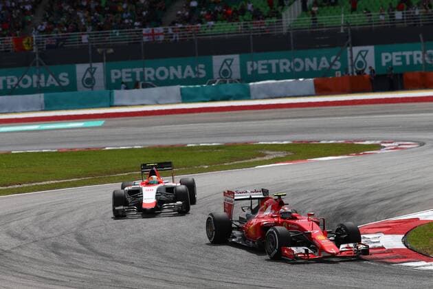 29.03.2015- Race, Kimi Raikkonen (FIN) Scuderia Ferrari SF15-T and Roberto Merhi (ESP) Manor Marussia F1 Team Malaysian Grand Prix, Sepang 26 - 29 March 2015 