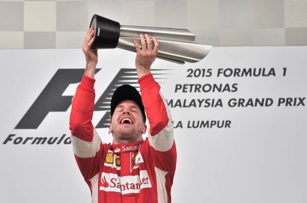 (150329) -- SEPANG, March 29, 2015 -- Ferrari driver Sebastian Vettel of Germany celebrates on the podium after winning the Malaysian Formula One Grand Prix in Sepang, Malaysia, March 29, 2015. ) (SP)MALAYSIA-SEPANG-F1 ChongxVoonxChung 