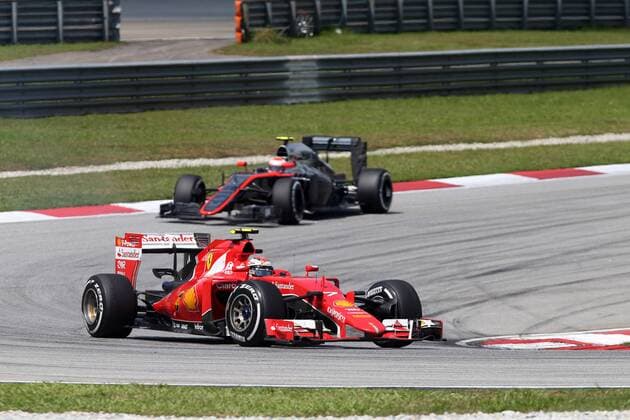 29.03.2015- Race, Kimi Raikkonen (FIN) Scuderia Ferrari SF15-T leads Jenson Button (GBR) McLaren Honda MP4-30. Malaysian Grand Prix, Sepang 26 - 29 March 2015 