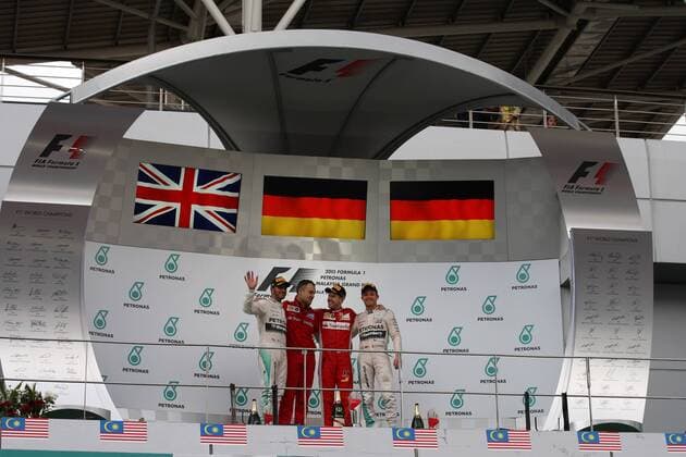 29.03.2015- Race, 1st position Sebastian Vettel (GER) Scuderia Ferrari SF15-T, 2nd position Lewis Hamilton (GBR) Mercedes AMG F1 W06 and 3& xe0; Nico Rosberg (GER) Mercedes AMG F1 W06 Malaysian Grand Prix, Sepang 26 - 29 March 2015 