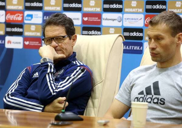 MOSCOW REGION, RUSSIA. MARCH 30, 2015. The head coach of the Russian national football team, Fabio Capello (L), and captain Vasily Berezutsky give a press conference PK Pressekonferenz ahead of an International Friendly LÃ¤nderspiel between the national teams of Russia and Kazakhstan. Artyom Korotayev TASS  RE15FEAC