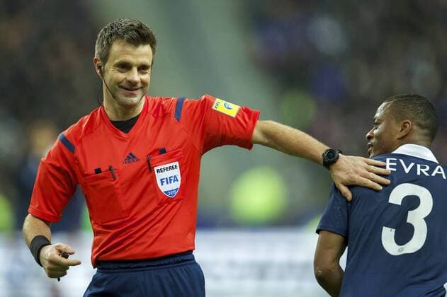 (L-R) referee Nicola Rizzoli, Patrice Evra of France during the International Friendly Länderspiel match between France and Brazil on March 26, 2015 at Stade France in Paris, France. France v Brazil International Friendly 2014 2015 xVIxxIVx 3732116
