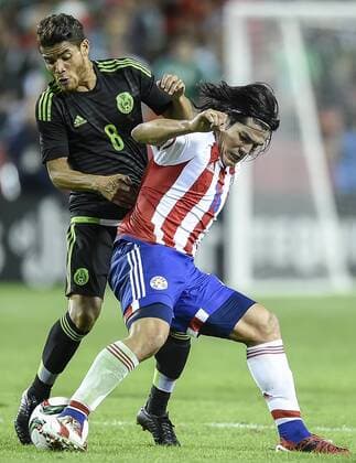 March 31, 2015 - Kansas City, MO, USA - Mexico s Jonathan Dos Santos (8) battles for possession with Paraguay s Fidencio Oviedo (16) in the first half during a friendly on Tuesday, March 31, 2015, at Arrowhead Stadium in Kansas City, Mo. Paraguay vs. Mexico - ZUMAm67_
