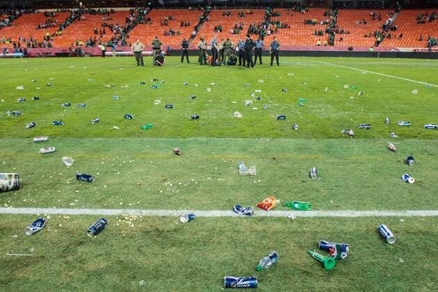 March 31, 2015: Trash lays on the field after fights and many fans threw trash and bottles at police as they tried to subdue fans rushing the field after the CONCACAF international exhibition soccer game between Mexico and Paraguay at Arrowhead Stadium in Kansas City, Missouri. Mexico won 1-0 SOCCER: MAR 31 Paraguay v Mexico Icon1503310671 EDITORIAL USE ONLY